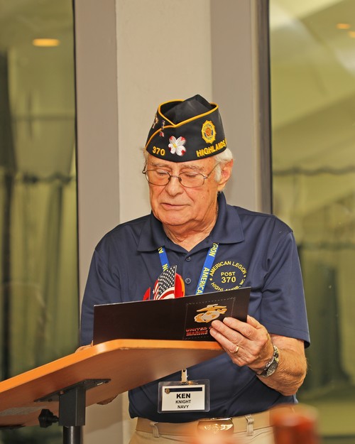 American Legion Post 370 Adjutant, Ken Knight, presents immediate Past Commander Ed McCloskey with a humorous card.